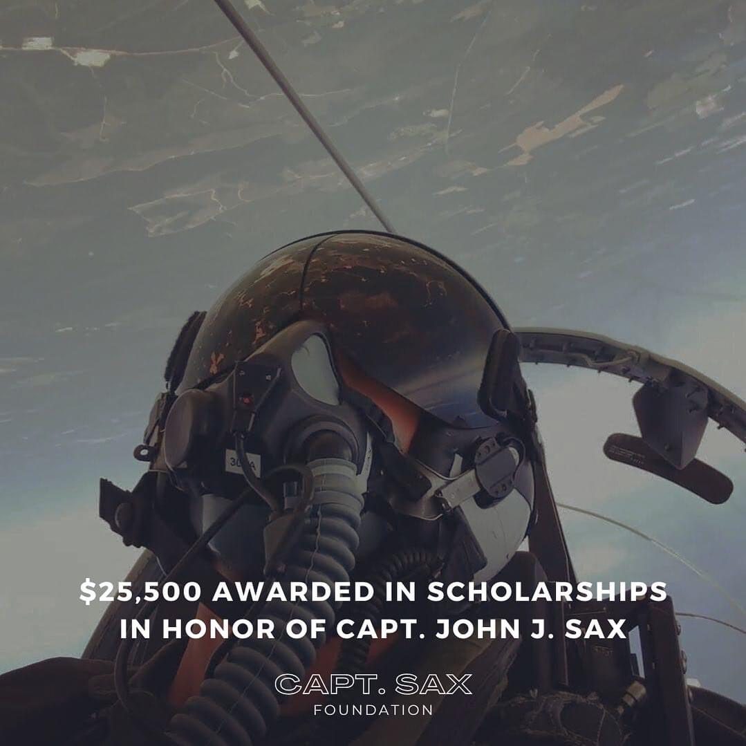 A person in a fighter jet with the caption " $ 2 5, 5 0 0 awarded in scholarships in honor of capt. John j.