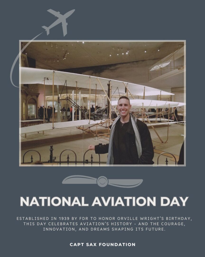 John Sax standing by the Wright brother plane in DC